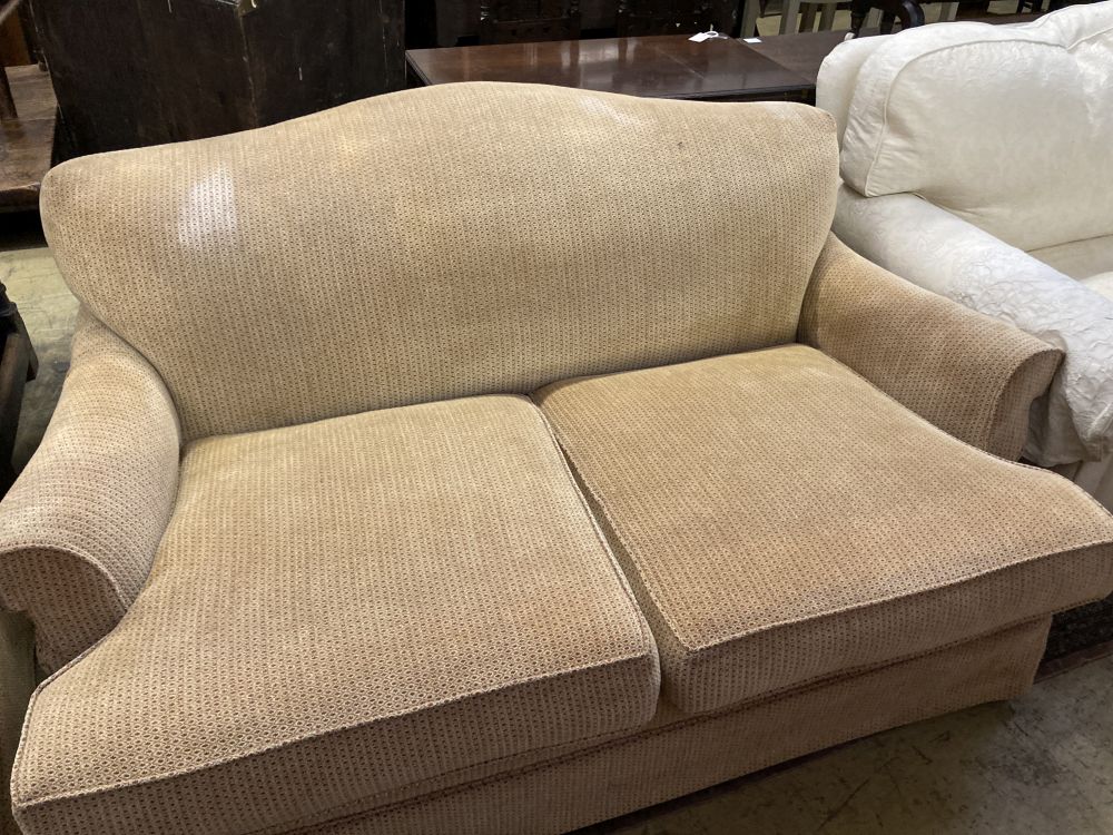 A pair of contemporary beige upholstered two seater settees, width 180cm depth 106cm max height 80cm